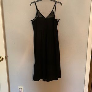 Black midi dress with sheer fabric at top and bottom